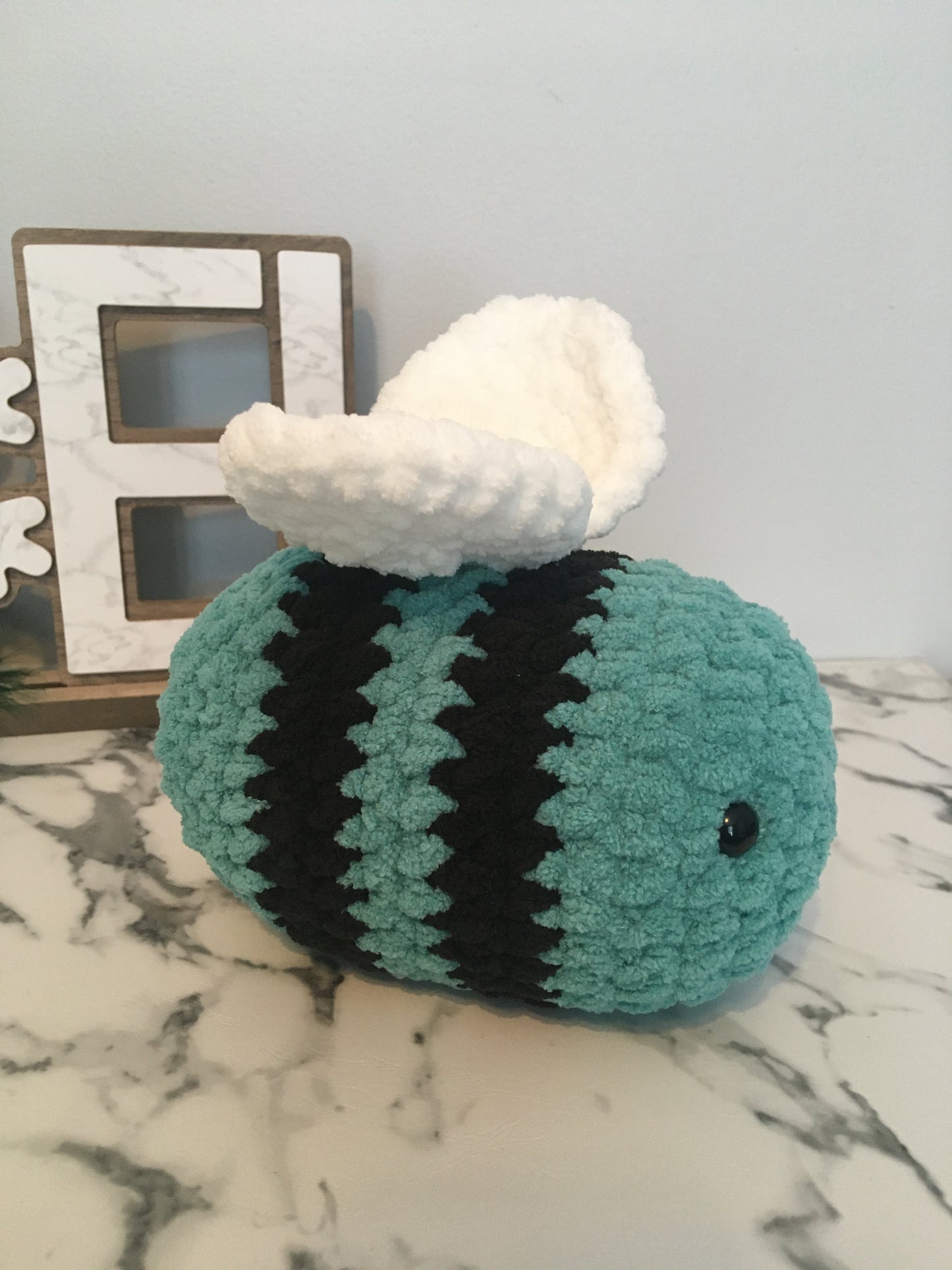 Abeille turquoise et noire